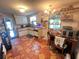 Galley kitchen featuring white cabinets, unique countertops, and tiled floors at 12127 Hunter Ave, Port Charlotte, FL 33953