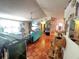 Bright and airy living room with terra cotta tile flooring, vaulted ceilings and an open floor plan at 12127 Hunter Ave, Port Charlotte, FL 33953