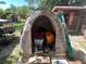 Brick structure with built-in barbecue pit for outdoor cooking, perfect for entertaining at 12127 Hunter Ave, Port Charlotte, FL 33953