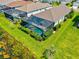 Aerial shot showcasing a private pool with screened enclosure and well-maintained landscaping at 13849 Old Creek Ct, Parrish, FL 34219