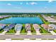 Aerial view of houses with pools in a new residential community near a central lake at 13849 Old Creek Ct, Parrish, FL 34219