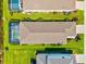 Aerial view of a single-Gathering home with a pool, screened-in patio, and a well-manicured lawn at 13849 Old Creek Ct, Parrish, FL 34219