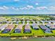 Aerial view of homes with screened pools, water features, and landscaping in a residential community at 13849 Old Creek Ct, Parrish, FL 34219