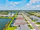 Aerial view of a new residential neighborhood with houses and community lakes and landscaping at 13849 Old Creek Ct, Parrish, FL 34219
