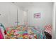 Colorful bedroom with closet and bathroom access at 13849 Old Creek Ct, Parrish, FL 34219