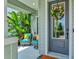 Welcoming entrance featuring a wreath and cozy seating area, creating a charming curb appeal at 13849 Old Creek Ct, Parrish, FL 34219