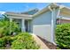 Inviting front entrance with a beautifully landscaped walkway leading to the front door at 13849 Old Creek Ct, Parrish, FL 34219
