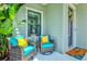 Cozy front porch featuring comfortable seating, decorative accents, and a welcoming ambiance at 13849 Old Creek Ct, Parrish, FL 34219
