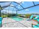 Relaxing screened-in pool area with sun shelf and comfortable seating, perfect for enjoying the serene lake views at 13849 Old Creek Ct, Parrish, FL 34219