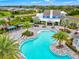 A stunning aerial view of a community pool featuring ample seating and a beautiful clubhouse at 13849 Old Creek Ct, Parrish, FL 34219