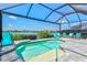 Inviting swimming pool with lounge chairs overlooking a serene lake at 13849 Old Creek Ct, Parrish, FL 34219