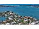 Stunning waterfront property surrounded by lush landscaping, providing a private tropical oasis with beautiful water views at 1387 Harbor Dr, Sarasota, FL 34239