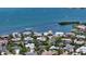 Wonderful aerial view showcasing waterfront homes with lush landscaping and ocean views at 1387 Harbor Dr, Sarasota, FL 34239