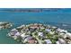 Waterfront property featuring lush landscaping, boat access, and views of the bay, neighborhood, and city at 1387 Harbor Dr, Sarasota, FL 34239