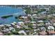 Aerial view of waterfront homes surrounded by beautiful landscaping and a canal at 1387 Harbor Dr, Sarasota, FL 34239