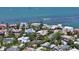 Aerial view of waterfront homes featuring lush landscaping and beautiful ocean view at 1387 Harbor Dr, Sarasota, FL 34239