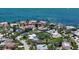 Waterfront property featuring lush landscaping, beautiful bay views, and surrounded by other luxurious homes at 1387 Harbor Dr, Sarasota, FL 34239