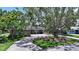 Charming single-story home with a well-manicured lawn and mature trees at 1387 Harbor Dr, Sarasota, FL 34239