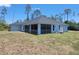 Home exterior featuring a screened lanai perfect for enjoying the outdoors at 1422 Jakway Rd, North Port, FL 34288