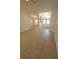 Inviting entryway with arched doorways, tile flooring, and double doors with transom window at 1422 Jakway Rd, North Port, FL 34288