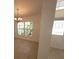 Inviting foyer featuring tile flooring and a chandelier at 1422 Jakway Rd, North Port, FL 34288