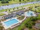 Aerial view of community pool and recreational areas by lake at 14787 Gallop Run Dr, Lithia, FL 33547