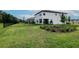 Large backyard and exterior view of house with black metal fencing at 14787 Gallop Run Dr, Lithia, FL 33547