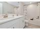 Bright bathroom with double sink vanity and tiled shower/tub at 14787 Gallop Run Dr, Lithia, FL 33547