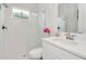 Clean bathroom with a glass-enclosed shower, white subway tile, and vanity with modern fixtures at 14787 Gallop Run Dr, Lithia, FL 33547