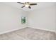 Neutral bedroom with carpet and window view at 14787 Gallop Run Dr, Lithia, FL 33547