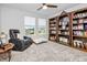 Bedroom with book shelves and reading chair at 14787 Gallop Run Dr, Lithia, FL 33547