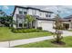 Charming two-story home features stone accents, a two-car garage, and a beautifully landscaped front yard at 14787 Gallop Run Dr, Lithia, FL 33547