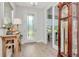 Bright foyer with light floors and a glass-paneled door that leads to a naturally lit area at 14787 Gallop Run Dr, Lithia, FL 33547