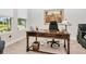 Bright home office with a large desk, natural light and neutral paint at 14787 Gallop Run Dr, Lithia, FL 33547