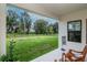 Covered patio looking out at large backyard and green space at 14787 Gallop Run Dr, Lithia, FL 33547