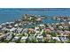 Aerial view showcasing waterfront property and neighborhood, with the featured home circled at 1607 Flower Dr, Sarasota, FL 34239