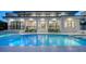 A spacious, modern home features a beautiful backyard with an in-ground pool and covered patio at 1607 Flower Dr, Sarasota, FL 34239