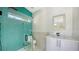 Modern bathroom features glass shower with colorful tile and sleek vanity at 1607 Flower Dr, Sarasota, FL 34239