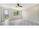 Bright bedroom featuring herringbone floors, natural light, and a door to the outside at 1607 Flower Dr, Sarasota, FL 34239