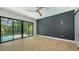 Primary bedroom featuring hardwood floors and sliding glass door to a balcony with a view at 1607 Flower Dr, Sarasota, FL 34239