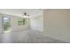 Bright bedroom with herringbone floors, a private balcony, large windows and neutral walls at 1607 Flower Dr, Sarasota, FL 34239