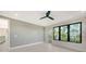 Bright bedroom with a balcony, large windows, and neutral decor at 1607 Flower Dr, Sarasota, FL 34239