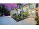 Luxurious home featuring a modern design with meticulously landscaped front yard and palm trees at 1607 Flower Dr, Sarasota, FL 34239