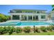 An impressive modern home with a beautiful pool and lush landscaping, perfect for luxurious outdoor living at 1607 Flower Dr, Sarasota, FL 34239