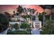 Contemporary home with palm trees, sleek lines, and well-manicured landscaping at 1607 Flower Dr, Sarasota, FL 34239