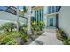 Contemporary home showcasing lush landscaping, clean lines, and a welcoming entrance at 1607 Flower Dr, Sarasota, FL 34239