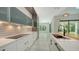 Modern kitchen with stainless appliances, light countertops and modern cabinetry at 1607 Flower Dr, Sarasota, FL 34239