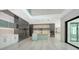 Modern kitchen featuring sleek cabinets, an island with a sink and state-of-the-art appliances at 1607 Flower Dr, Sarasota, FL 34239
