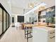 Open floor plan showcases modern kitchen, dining area, and living space with lots of light at 1607 Flower Dr, Sarasota, FL 34239