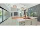 Open kitchen with island sink, top appliances, seamlessly integrated with the living space for modern living at 1607 Flower Dr, Sarasota, FL 34239